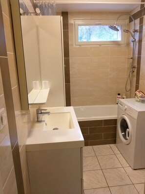 Combined shower/tub, hair dryer, towels, soap