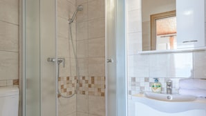 A modern bathroom with a glass-enclosed shower, a white sink, and a toilet. - Rooms Sani - Double Room with Terrace and Sea View (S1) (Brela)