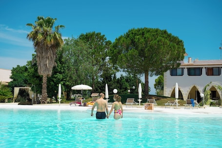 Seasonal outdoor pool, open 9:00 AM to 8:00 PM, pool umbrellas. Villa Conca Marco