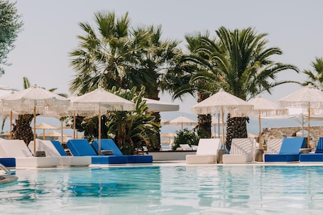 Outdoor pool, open 11:00 AM to 8:00 PM, pool umbrellas, sun loungers