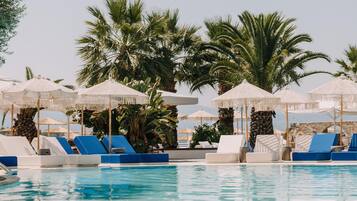 Outdoor pool, open 11:00 AM to 8:00 PM, pool umbrellas, pool loungers