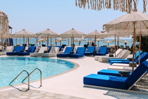 Outdoor pool, open 11:00 AM to 8:00 PM, pool umbrellas, pool loungers