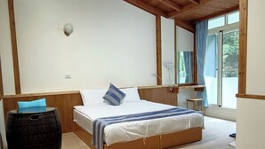 A wooden-paneled room with a bed, a small table, and a window. - Tian Pin Guest House (Lugu)
