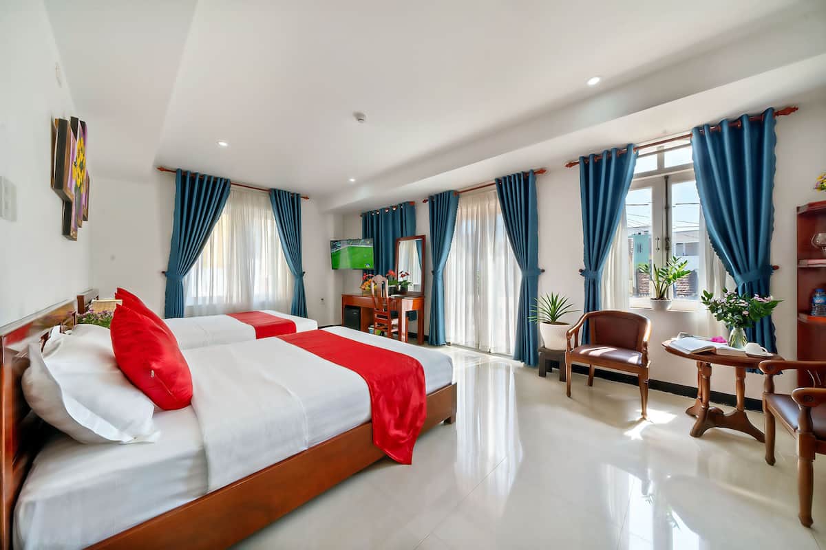 Family Room, Balcony, City View | Minibar, in-room safe, desk, laptop workspace