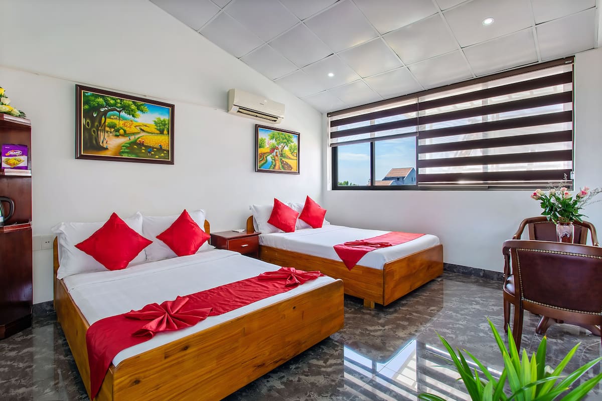 Family Room, City View | Minibar, in-room safe, desk, laptop workspace