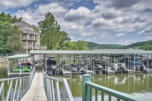 Enjoy serene lakeside views and access to a boat launch area with a covered dock.