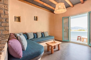 Suite estudio Elite, vista al mar | Área de sala de estar