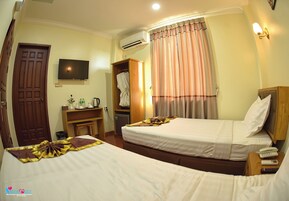 Standard Double or Twin Room | Minibar, in-room safe, desk, blackout drapes