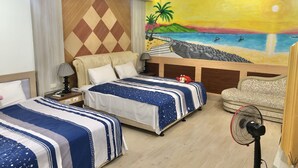 A hotel room with two beds, a sofa, a wall mural, and a standing fan. - Treehouse (Yanpu)