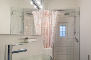 Shower, hair dryer, towels, shampoo