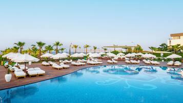 Indoor pool, outdoor pool, pool umbrellas, sun loungers