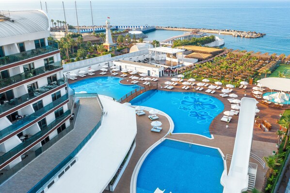 Indoor pool, outdoor pool, pool umbrellas, sun loungers