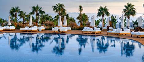 Indoor pool, outdoor pool, pool umbrellas, sun loungers