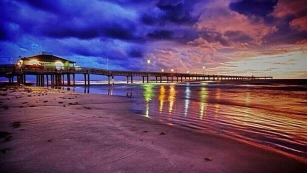 A pier extending into the water with a building at the end. - Discounted 30 Day Minimum Stay. 2bd. 2bth. Private 2nd floor Condo & balconies. (Corpus Christi)