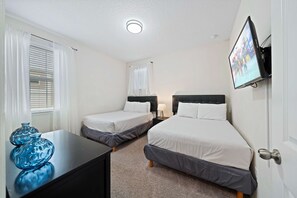 Bedroom 4 with 2 double beds and a private bathroom - Private Pool Oasis! 4BR Home w/ Patio near Disney (Kissimmee)