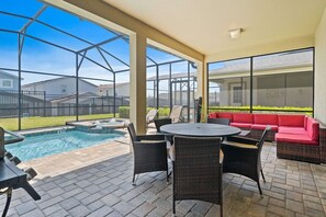 Outdoor dining - Private Pool Oasis! 4BR Home w/ Patio near Disney (Kissimmee)