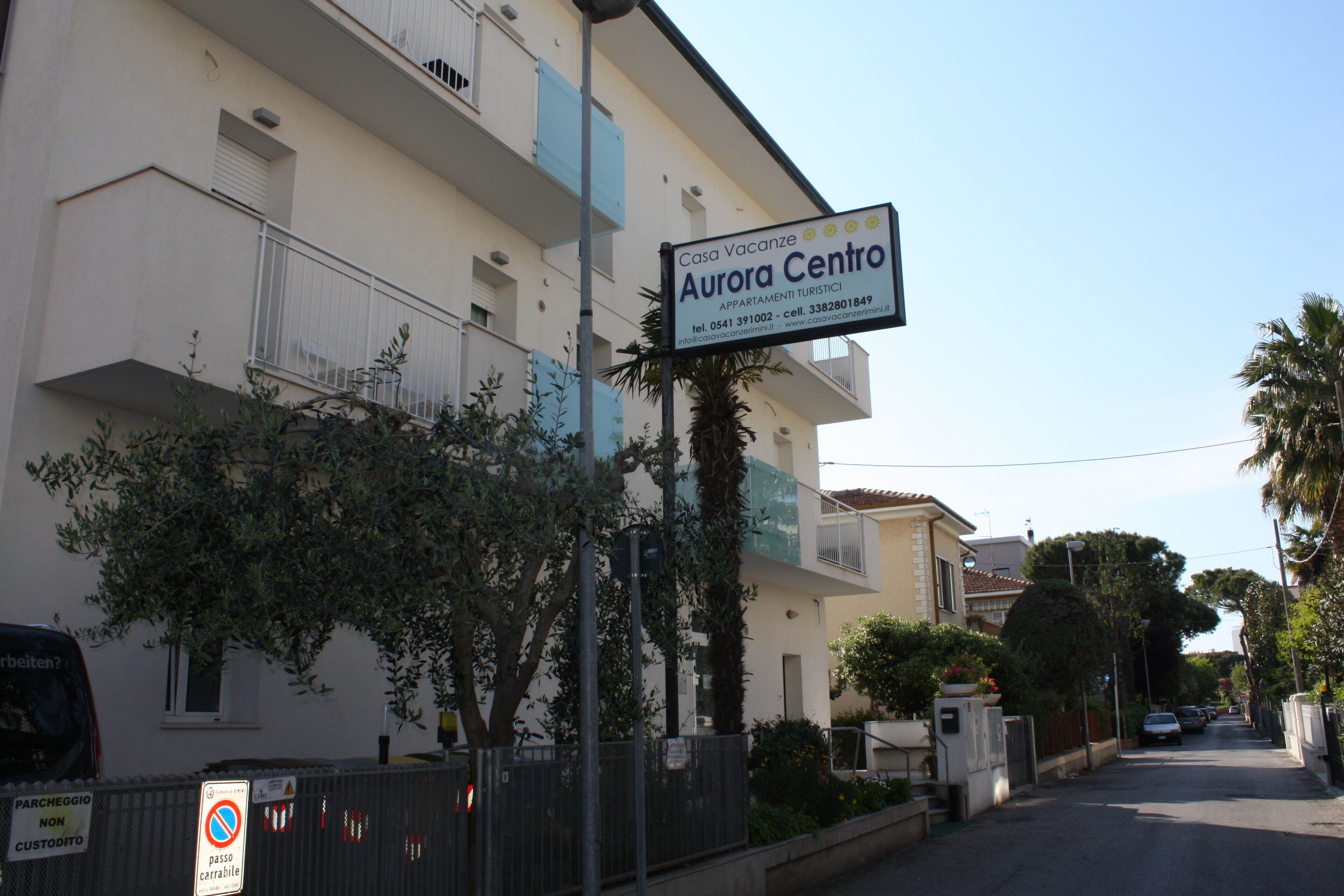 A building with a sign for 'Casa Vacanze Aurora Centro' indicating it is a tourist accommodation.