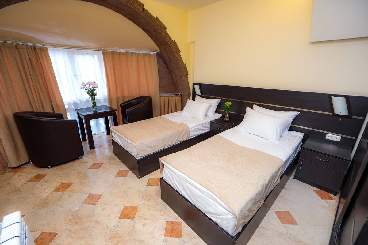 Standard Twin Room | Desk, laptop workspace, blackout drapes, iron/ironing board (on request)