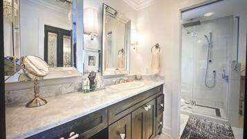 Combined shower/tub, hair dryer, towels, soap