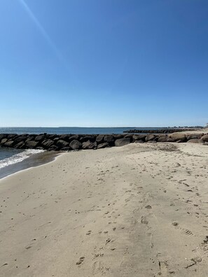 Enjoy a serene beach experience with a clear view of the ocean.