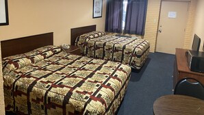 A hotel room with two beds, a desk, and a chair. - Deer Park Motor Inn (Deer Park)