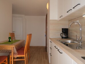 Microwave, toaster, dining tables