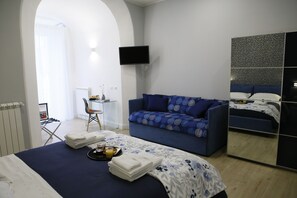 Chambre Quadruple Exécutive | Literie de qualité supérieure, couette en duvet d'oie