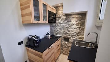 Mini-fridge, microwave, stovetop, electric kettle