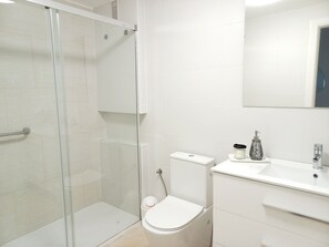 Shower, hair dryer, towels, soap