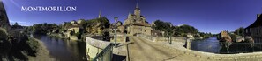 Montmorillon, a historic town with a river, stone bridges, and traditional architecture. - La Bicyclette Bleue (Montmorillon)