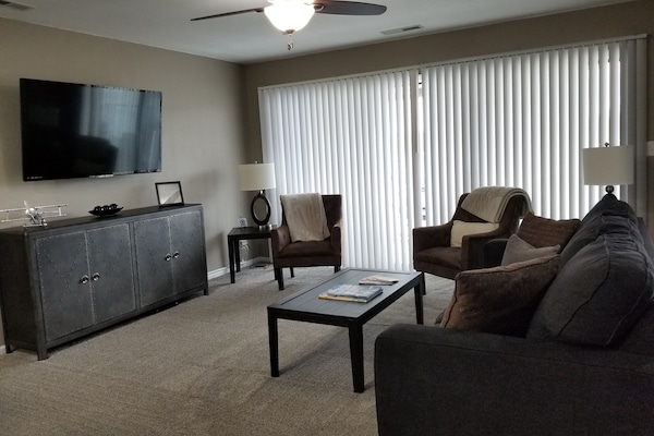 Large flat screen with tilt and swing arm. Smart TV with Spectrum cable.