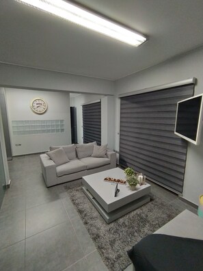 Apartamento luxo, 1 cama de casal | Sala de estar