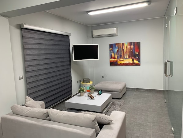 Apartamento luxo, 1 cama de casal | Sala de estar