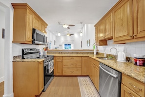 Microwave, dishwasher, coffee/tea maker, cookware/dishes/utensils