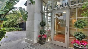 A building entrance with the name "THE MARGO" displayed above the glass doors. - Santana Row Properties #7 - Silicon Valley Getaway (San Jose)