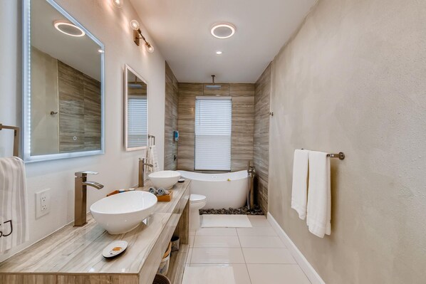 Bathtub, hair dryer, towels, soap