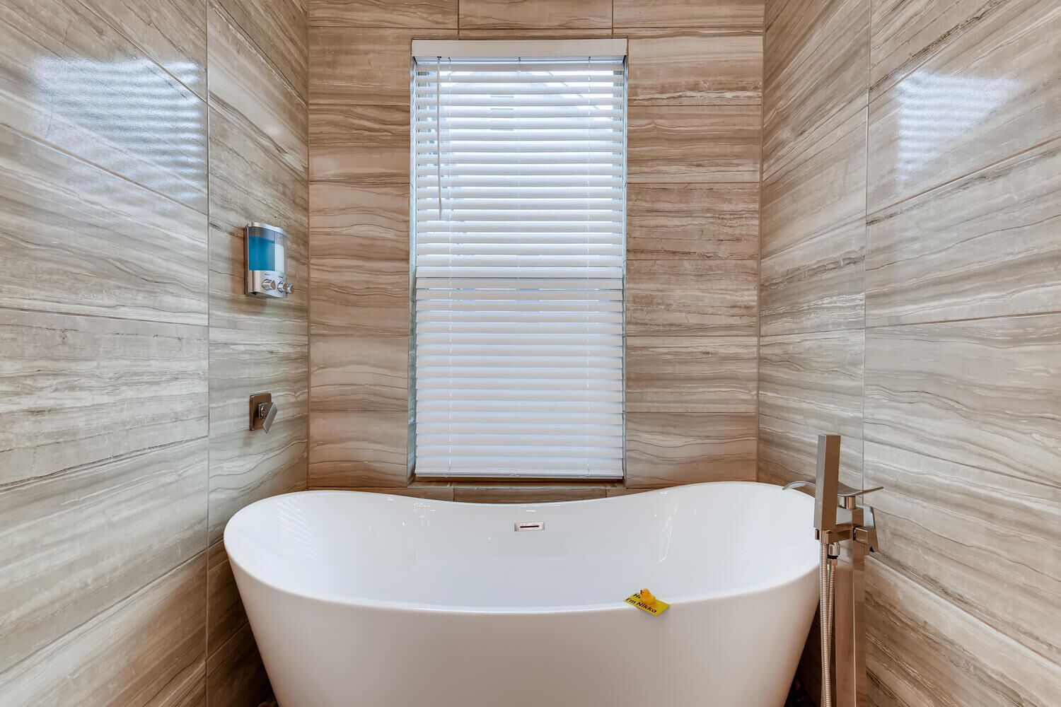 Bathtub, hair dryer, towels, soap