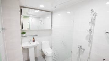 Mint House | Bathroom | Shower, free toiletries, hair dryer, slippers