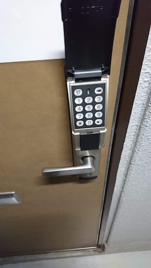 A door with a numeric keypad lock.