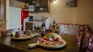 A wooden table with a charcuterie board, a bottle of wine, and glasses. - Typical, Charming With Chianti View (Bucine)