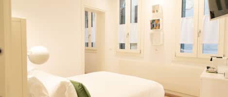 Premium bedding, down comforters, pillowtop beds, in-room safe