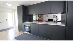 Departamento (1 Bedroom) | Cocina privada | Refrigerador, microondas, horno y parrilla de estufa 