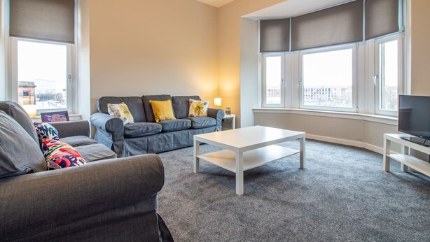 Living room - Modern, Bright + Spacious, 2BR City Centre Apt (Glasgow)