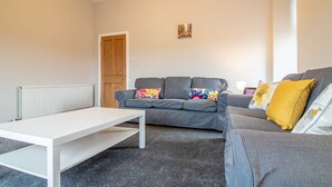 Living room - Modern, Bright + Spacious, 2BR City Centre Apt (Glasgow)