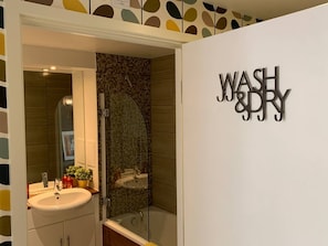 Bathtub, hair dryer, towels, soap