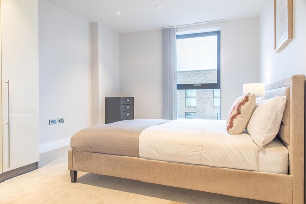 Apartment (2 Bedrooms) | Laptop workspace, iron/ironing board, bed sheets