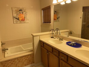 Combined shower/bathtub, towels, soap, shampoo