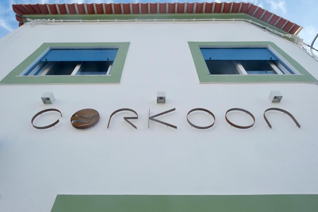 A building facade with the name "Corkoon" displayed in a unique font.