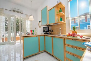 Family Apartment, 2 Bedrooms (Appartamento Bella Vista) | Private kitchen | Full-sized fridge, microwave, oven, stovetop
