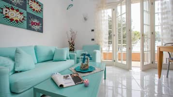Family Apartment, 2 Bedrooms (Appartamento Bella Vista) | Living area | 22-inch flat-screen TV with cable channels, TV